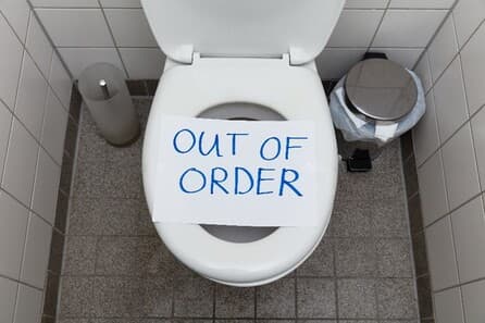 An “Out of Order” sign placed over a toilet in Carol Stream, IL.