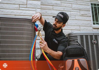 Precision Today technician connecting refrigerant gauges to an outdoor air conditioning unit