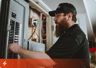 Precision Today electrician working inside a residential electrical panel